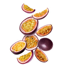 Delicious ripe passion fruits falling on white background