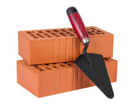Two orange bricks stacked with a masonry trowel resting on them.