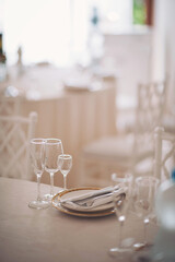 Elegant tablescape featuring fine dining setup in a beautifully decorated venue for a special celebration during daylight hours