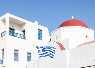Mykonos, Greece: white houses with greek flag