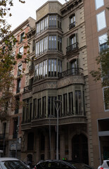 Fototapeta premium Art Nouveau building facade in Barcelona, Spain. Interesting Art Nouveau Architecture Buildings facade in Barcelona, Spain. (Arquitectura modernista). These fancy buildings date for the most from the 