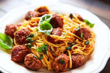 Spaghetti Pasta with Meatballs and fresh Basil. Close up.	