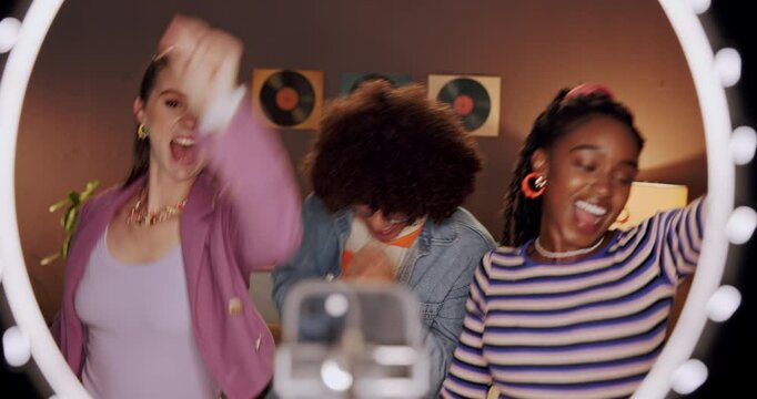 Night, ring light and friends in bedroom dance for social media, recording and post on internet. Influencer, content creator and people with energy for performance, viral video and online tutorial