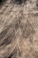 Vehicle tracks in the ground, creating endless possible paths..