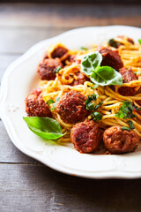 Spaghetti Pasta with Meatballs and fresh Basil. Close up. 