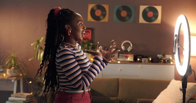 Phone, ring light and wave with black woman in home for influencer, promotion or smile. Social media content creator and recording with person and live streaming for vlog broadcast or follower advice