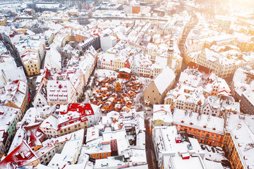 Aerial View of Tallinn with the Town Hall Square in winter, roofs with snow, Christmas mood