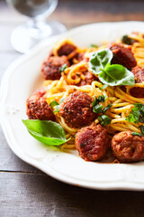 Spaghetti Pasta with Meatballs and fresh Basil. Close up.	