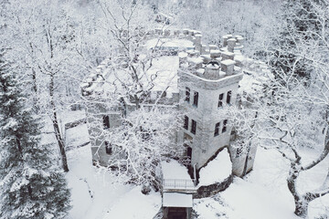 Old castle in the winter Glen park. Tallinn, Estonia.