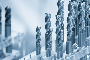 Close-up scene the group of bull nose or radius end mill tools in the light blue scene.