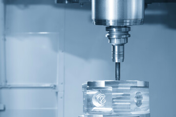  The 5-axis CNC milling machine cutting the aluminum gear case part by solid flat nose end mill tool in the light blue scene.