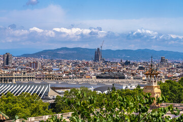 Aerial panorama view of Barcelona cityscape with Sagrada Familia temple from viewponit of National Art Museum of Catalonia in summer, Bercelona, Catalonia, Spain