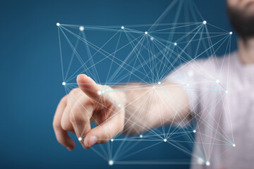 Hand interacting with a digital network.  Modern technology, connection, and global communication.