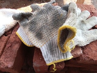 Gloves on red stone, object