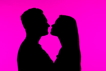 Silhouette of Couple in Artistic Pink Background Portrait