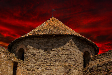 Dramatic Sunset over Ancient Stone Fortress – Majestic Sky and Historic Architecture

