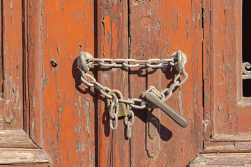 Chain With Padlock at Old Abandoned House Door Gate