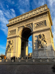 Fototapeta premium Paris, France - January 7, 2025: Side view of the Arc de Triomphe on a sunny day