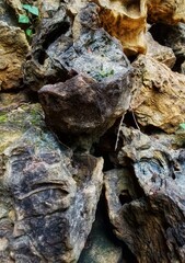 Close-up of weathered rock formations showcasing rugged textures and natural patterns, revealing the raw beauty and timeless strength shaped by nature’s forces over time.
