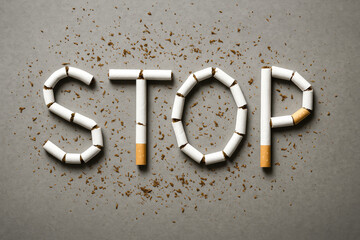 The concept quitting emphasizes determination and change symbolized by broken cigarette pieces arranged to encourage stopping harmful habits