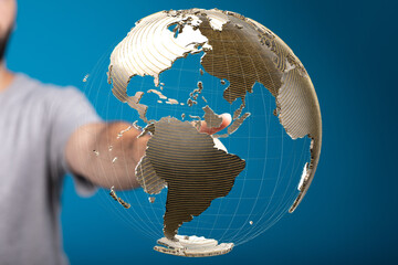 Person interacts with a 3D digital globe, representing global network connections and worldwide...