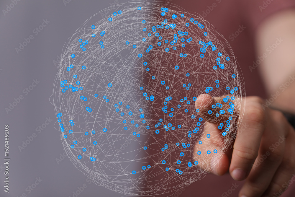 Aufkleber hand interacting with a digital globe, showcasing global network and connection.