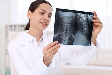 Doctor examining MRI scan in hospital, selective focus