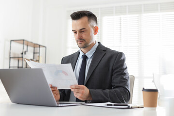 Marketing. Man working at desk in office