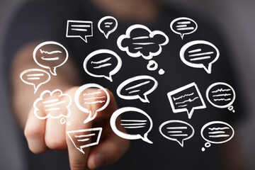 Hand pointing at digital speech bubbles,communication, feedback, conversation concept.