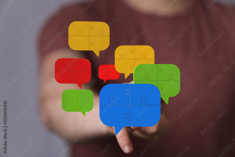 Poster teamwork, communication, and problem-solving visualized with colorful puzzle pieces.