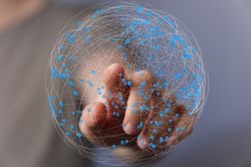 Abstract image of a hand interacting with a digital sphere representing global network connections...