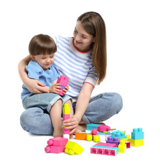 Mother and son playing with building bricks on white background