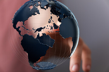 Abstract image of a hand holding a digital globe, representing global connectivity and networking.