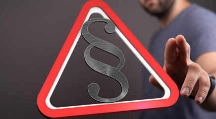 Stock photo of a red triangle warning sign with a paragraph symbol, representing legal issues or...
