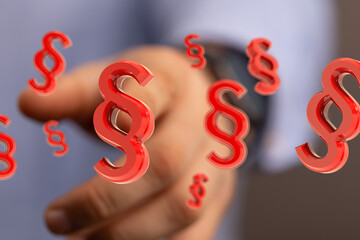 Abstract 3D rendering of red paragraph symbols floating near a hand. Perfect for legal, law, and...