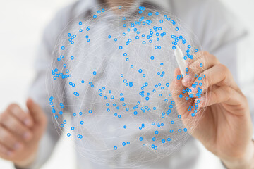 Person interacts with a digital globe, showcasing global connectivity and networking.