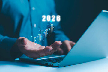 Businessman holds the growth and development of the company in 2026. Business, Marketing, Happy New Year 2026.