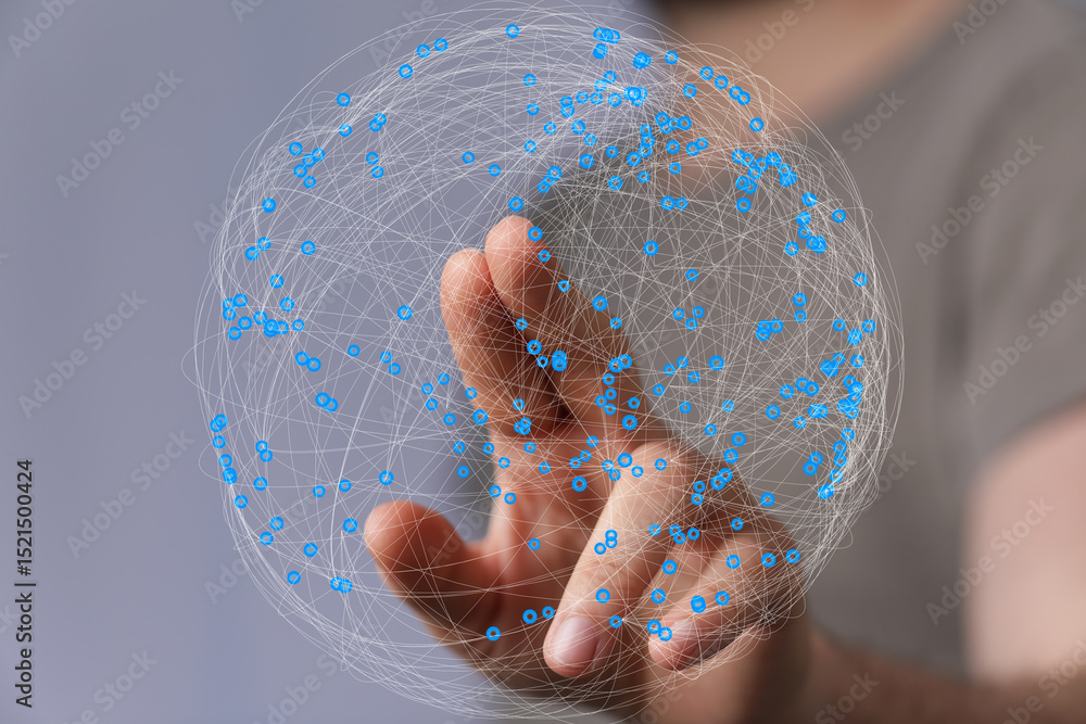 Fototapete abstract image of a hand interacting with a digital sphere representing global network connections.