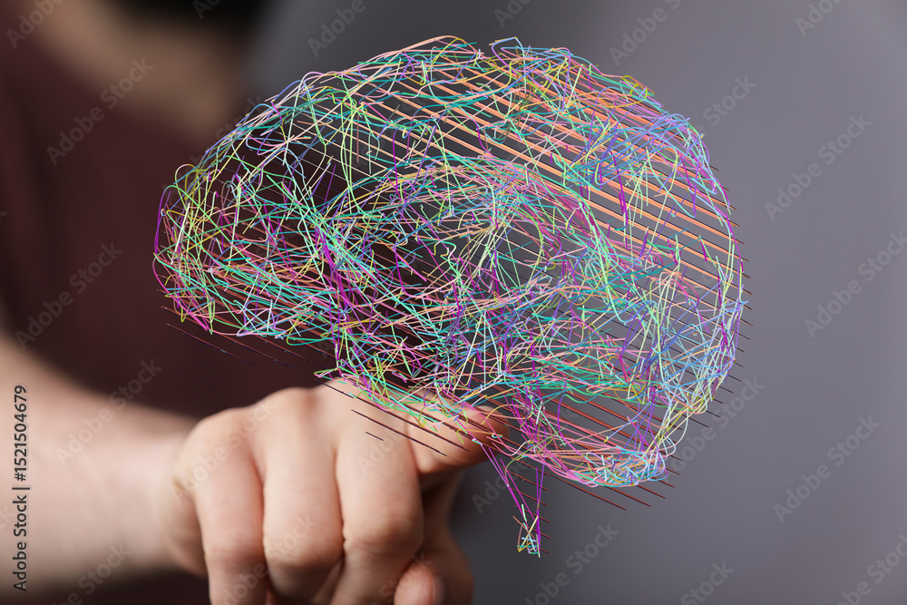 Leinwandbilder Stock photo of a hand interacting with a colorful abstract brain visualization, representing neural networks and AI.