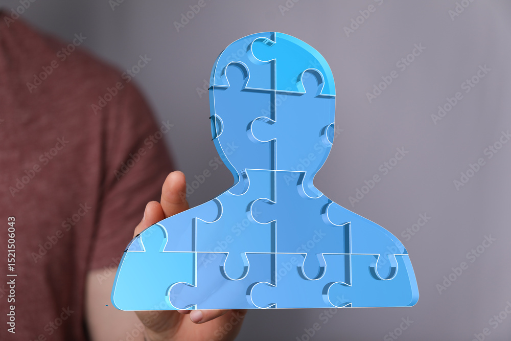 Poster abstract image of a person shaped puzzle. ideal for teamwork, collaboration, and connection.