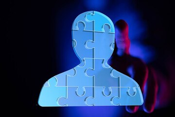 Abstract image of a person made of puzzle pieces.  Symbolizes teamwork, unity, collaboration, and...