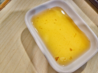 Plum Sauce in a ceramic cup top view.