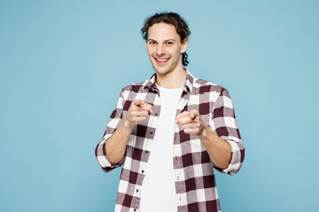 Young cool man wear purple checkered shirt casual clothes point index finger camera on you...