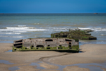 Arromanches-les-Bains, France - 05 16 2025: Detail view of the Mulberry Artificial harbour, the...