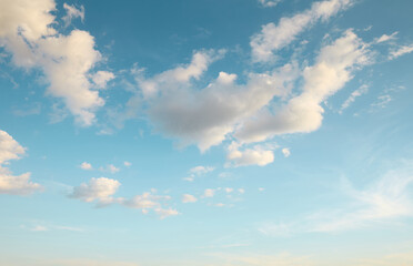 Beautiful sky with white fluffy cumulus clouds