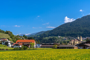 Beautiful view of Steinach am Brenner town in Wipptal valley with flowers and the Tyrolean Alps, south of Innsbruck in spring, Tyrol, Austria