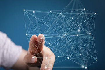 Abstract image of hand interacting with a digital network, representing connection and technology.