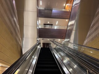 Interior of Bencoolen MRT Station with Curved Earth-Tone Walls, Singapore 