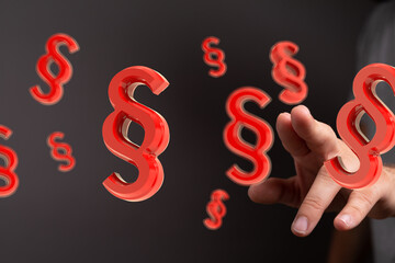 3D red paragraph symbols hover near a hand, illustrating legal concepts, law, and justice.