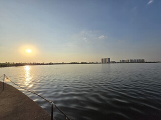 Sunset View Over Waterfront with City Skyline